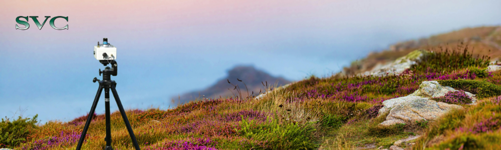 an SVC spectrometer stands in a field of heather