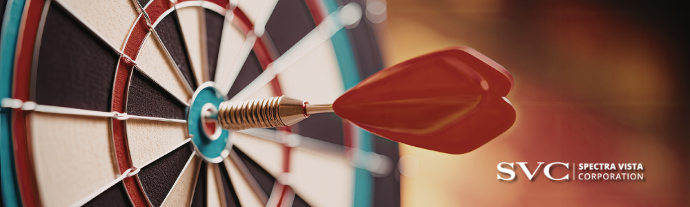 Red dart embedded in a dartboard with the SVC logo visible on the right side.